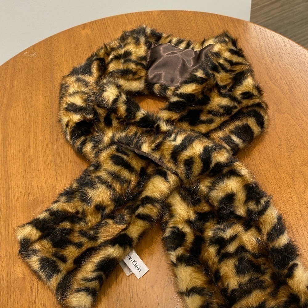 Calvin klein faux fur scarf, 45 inches long.​​​​​​​​​​​​​​​​​​​​​​​​​​​​​